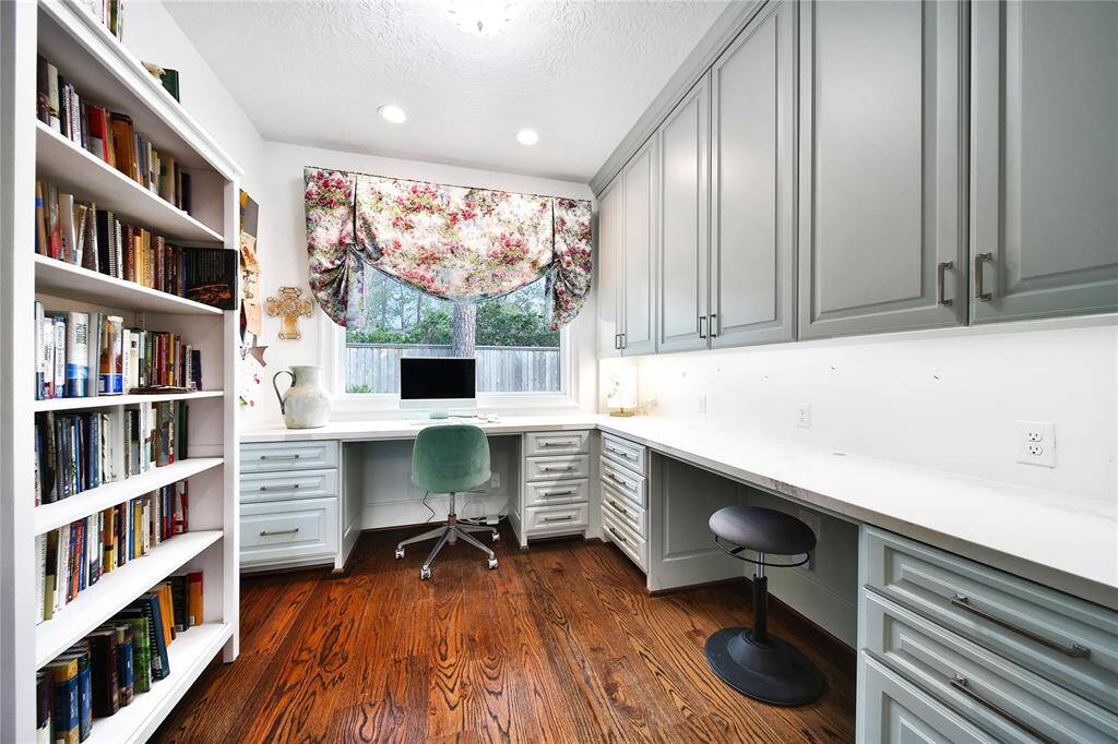Office nook with beautiful built ins located off the flex room.