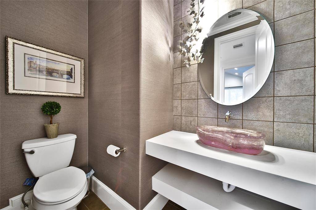 Powder bathroom located off the main hallway.