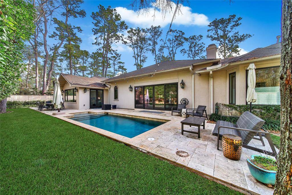 Beautiful backyard with pool and plenty of yard space.