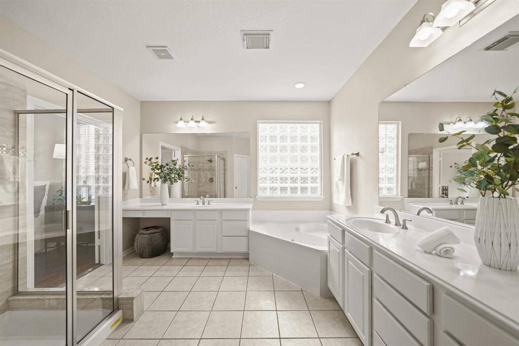 The primary bath has an oversized garden tub.
