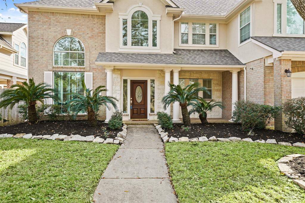 All flower beds have been freshly mulched and the yard is nicely manicured.