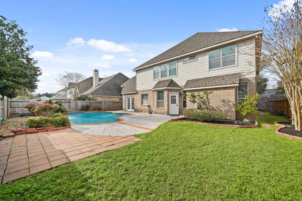 Even with the pool and deck, there is still plenty of green space for the kids and pets to run around and play!