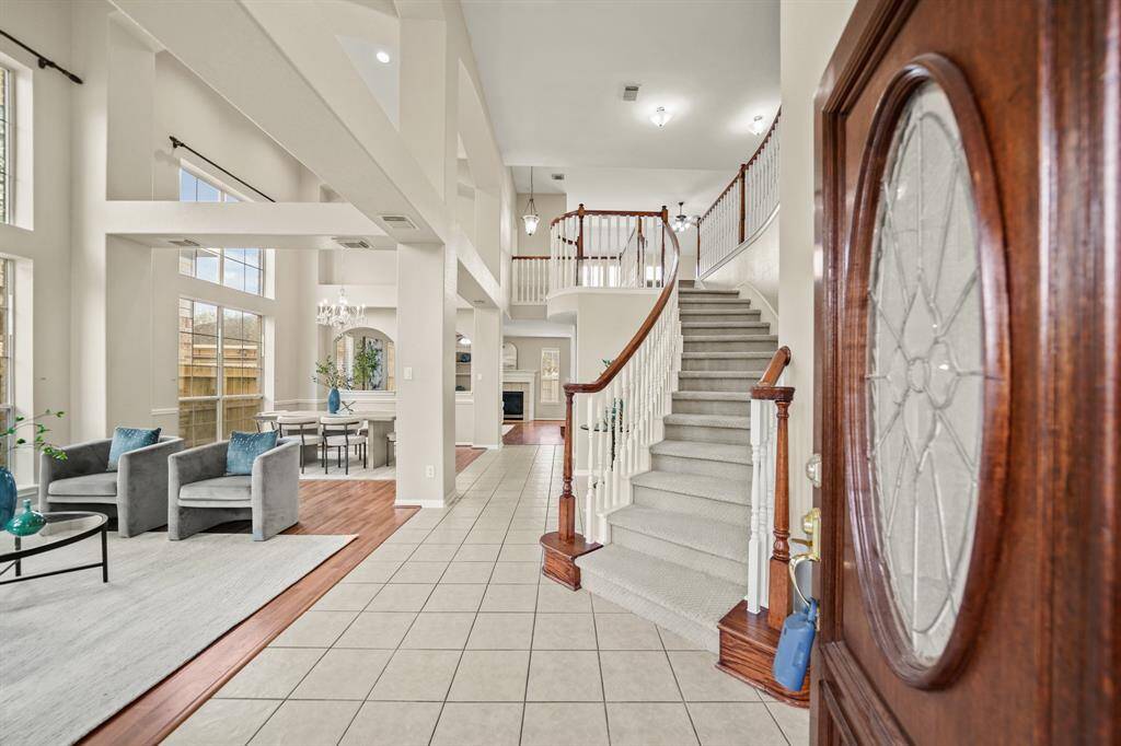 The entrance is very dramatic. This home has high ceilings throughout the foyer and both formals. The carpet on the dual staircase was just replaced.