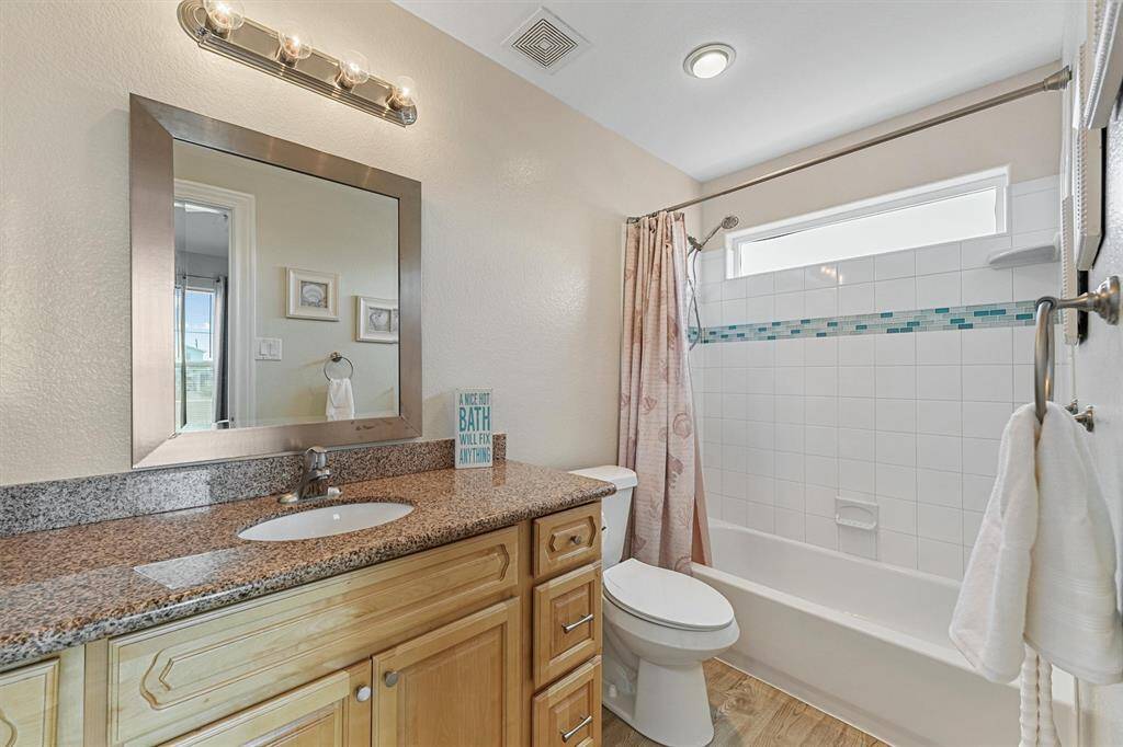 Primary Bathroom with natural light and custom tiles.