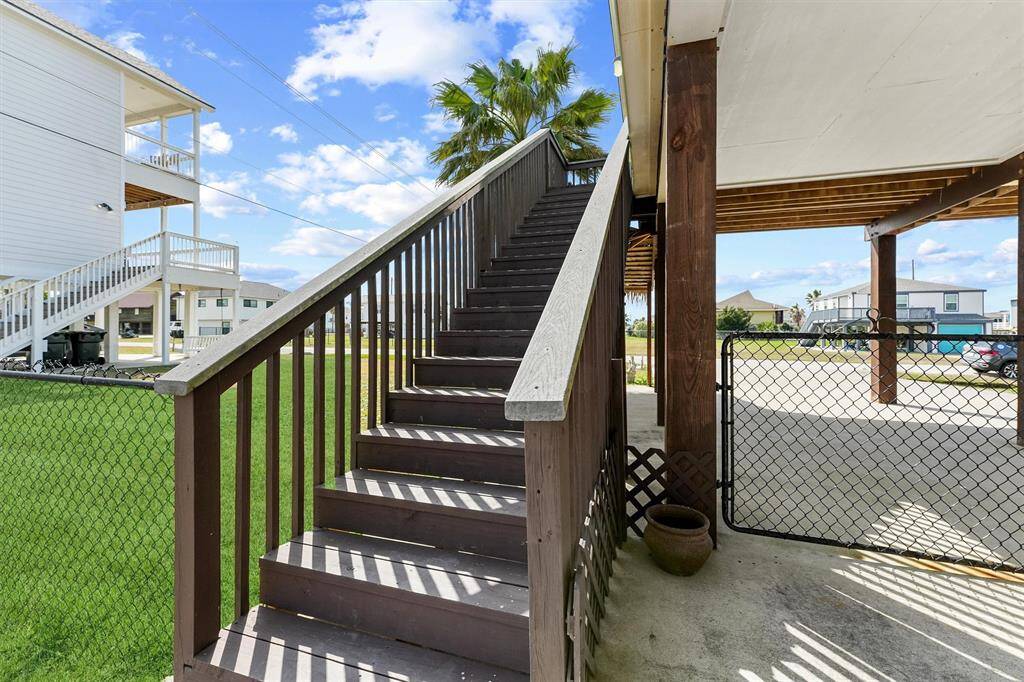 Staircase to paradise transitions you to a covered porch where you can unwind.