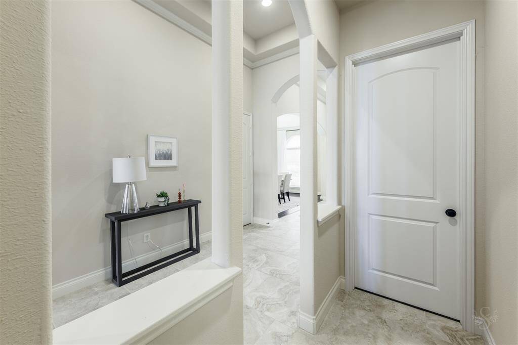 This hallway provides access to two spacious secondary bedrooms, offering privacy and a quiet retreat within the home.