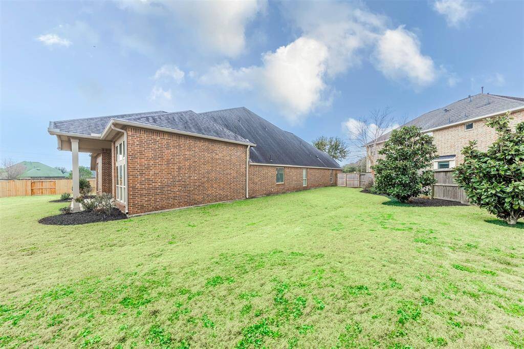 Come out back and view the spacious back yard that carries around to the side of the back of the home! Host backyard parties in this spacious green yard, run and play or simply enjoy all the amenities that Cross Creek Ranch has to offer!