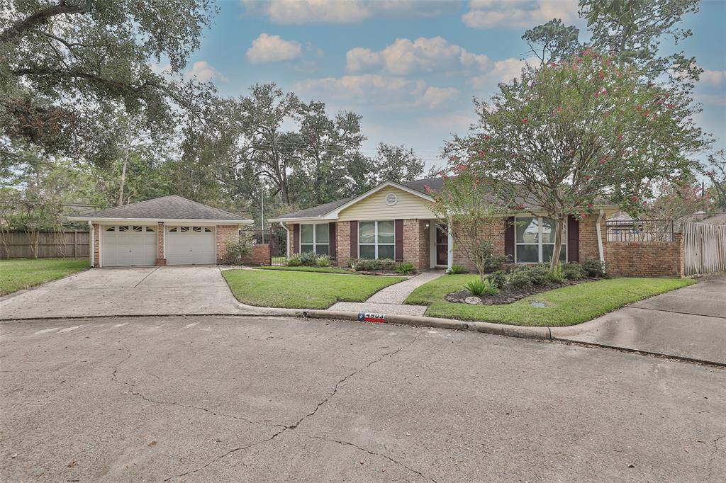 This home is situated at the end of the cul de sac! Has a small front yard but wait until you see the backyard!