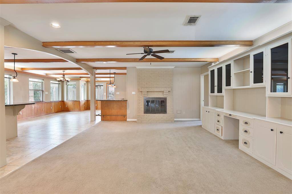 Built in book cases and gas log fire place complete your living area.