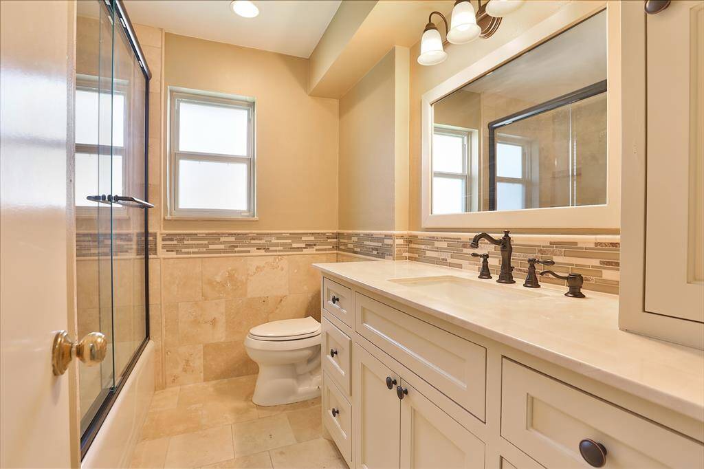Your remodeled hall bath complete with lots of counter and cabinet space.  Soft closing drawers and doors.