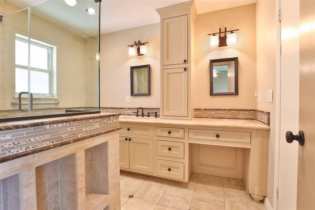 Primary bath area with soft closing drawers and cabinet doors.  Love the little niches by the shower!
