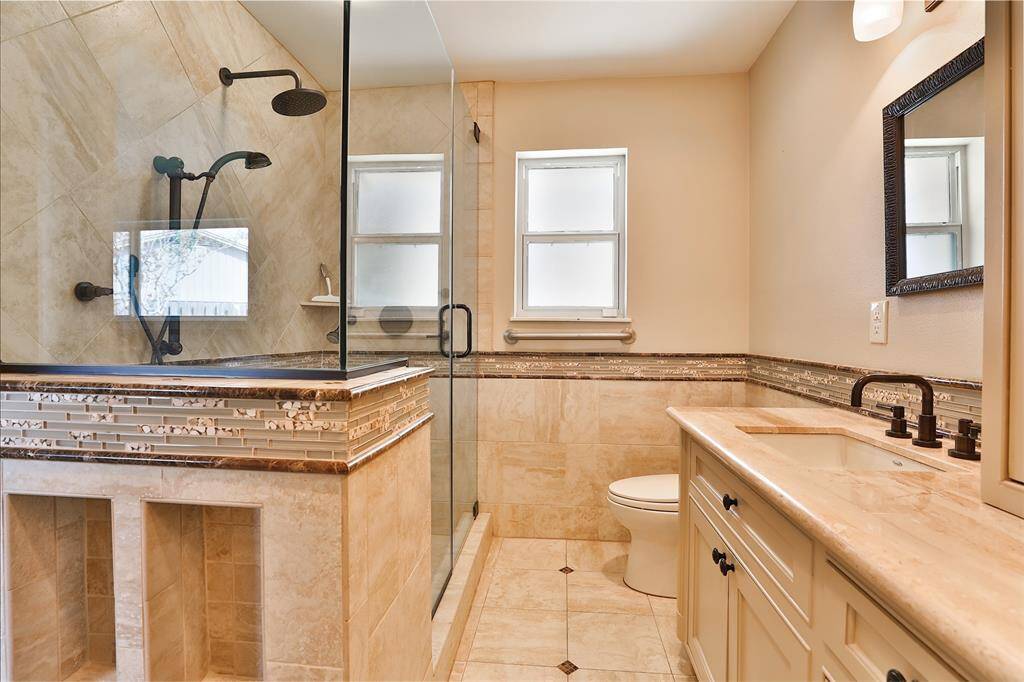 Glass enclosed shower with 3 shower heads!