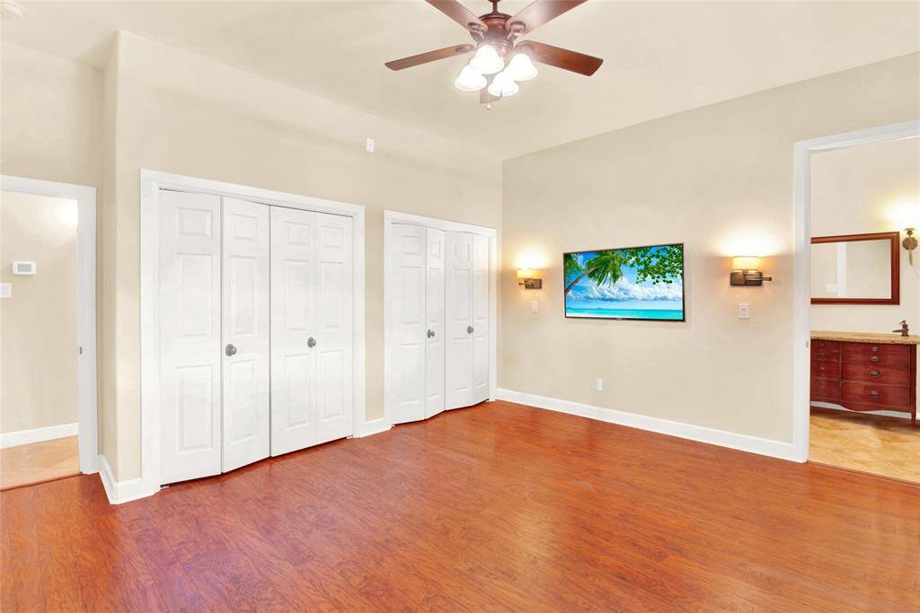 Another View Of These Gorgeous Wood Floors And The Double Custom Closets Decked Out With Rods & Selving In These Higher Ceilings!