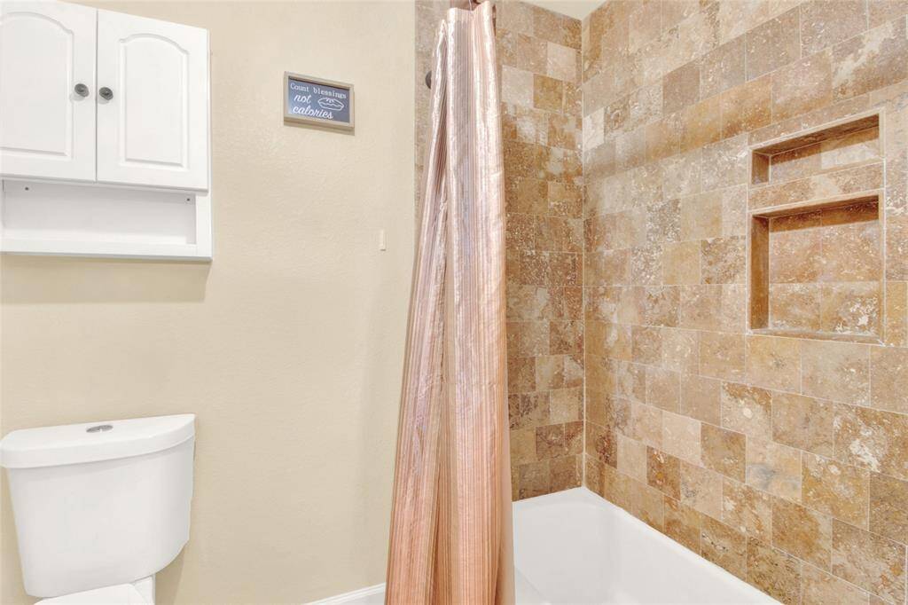 Upgraded Travertine Through This Shower And Bathroom