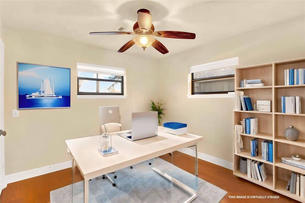 Another Secondary Bedroom With Wood Flooring And Double Windows....Staged Here