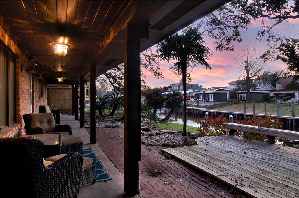 You'll Want To Spend All Your Time Outdoors Enjoying This Oversized Covered Back Deck!