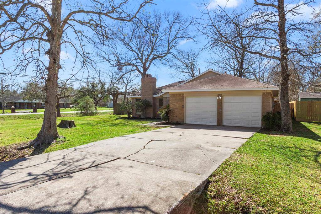 Two car garage with large driveway