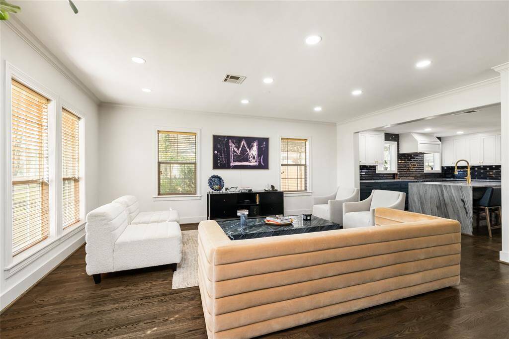Expansive and inviting living area is open to the kitchen and dining and is perfect for relaxation and entertaining
