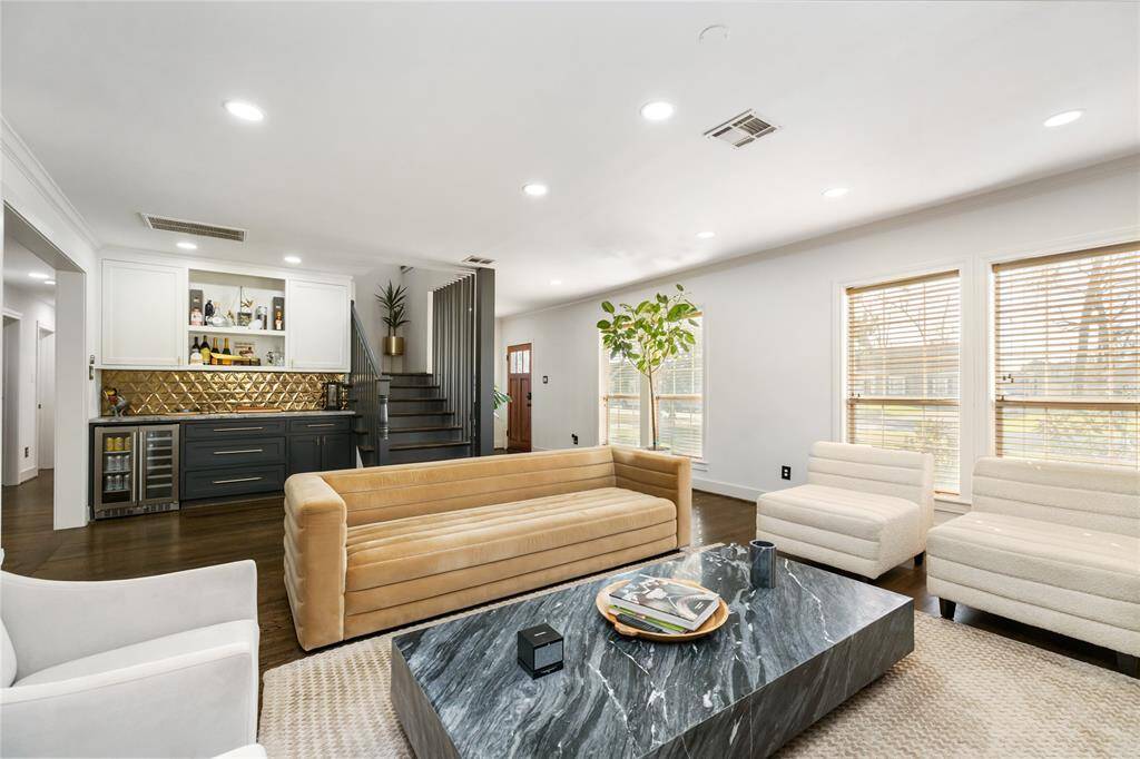 Perfect for hosting gatherings in living room with beautiful bar next to the kitchen and dining area