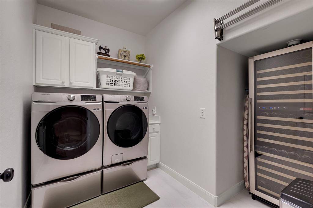 Modern laundry room. The room is well-lit and has a tidy, functional design.