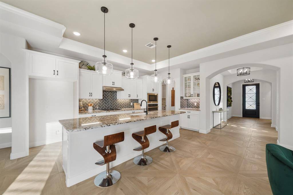 Elegant custom tile throughout, adding a touch of luxury to every space.