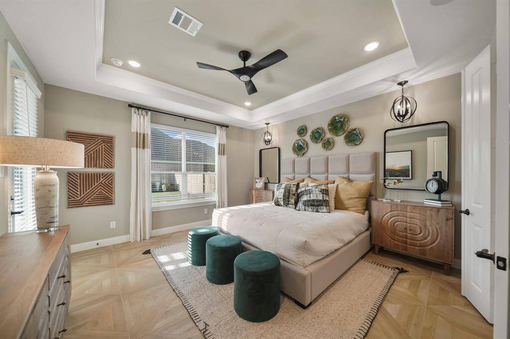 The luxurious primary suite offers a private retreat with its own exterior door leading to the expansive patio—perfect for enjoying morning coffee or evening relaxation.