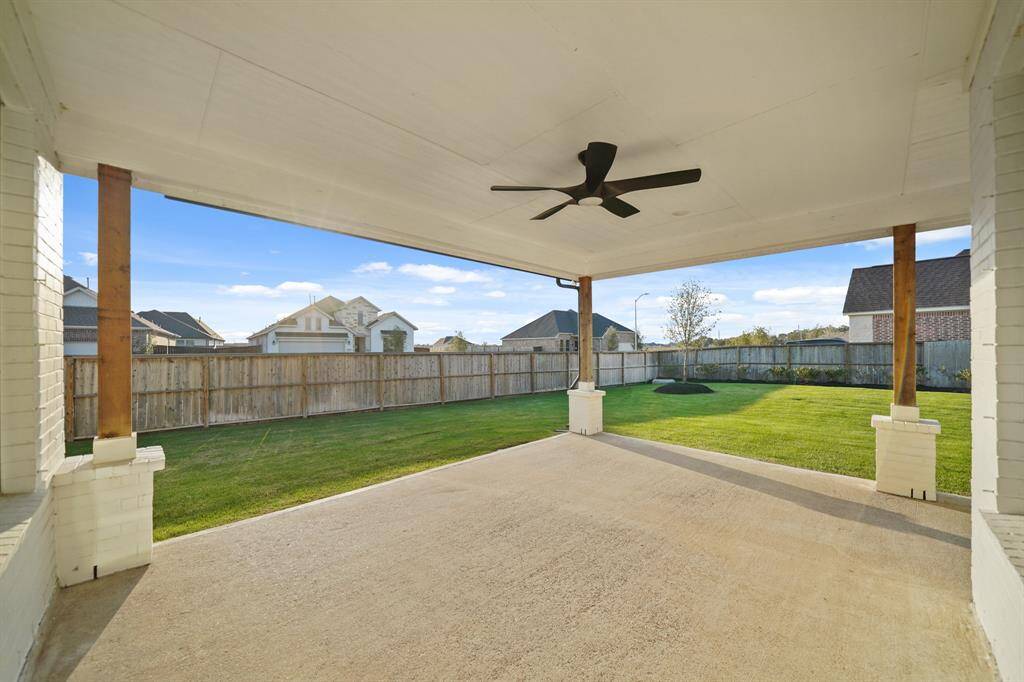 This oversized back patio offers the ultimate outdoor living experience, perfectly positioned on a premium corner lot for added privacy and space.
