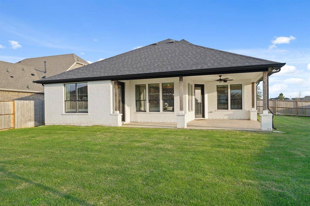 This oversized back patio offers the ultimate outdoor living experience, perfectly positioned on a premium corner lot for added privacy and space.