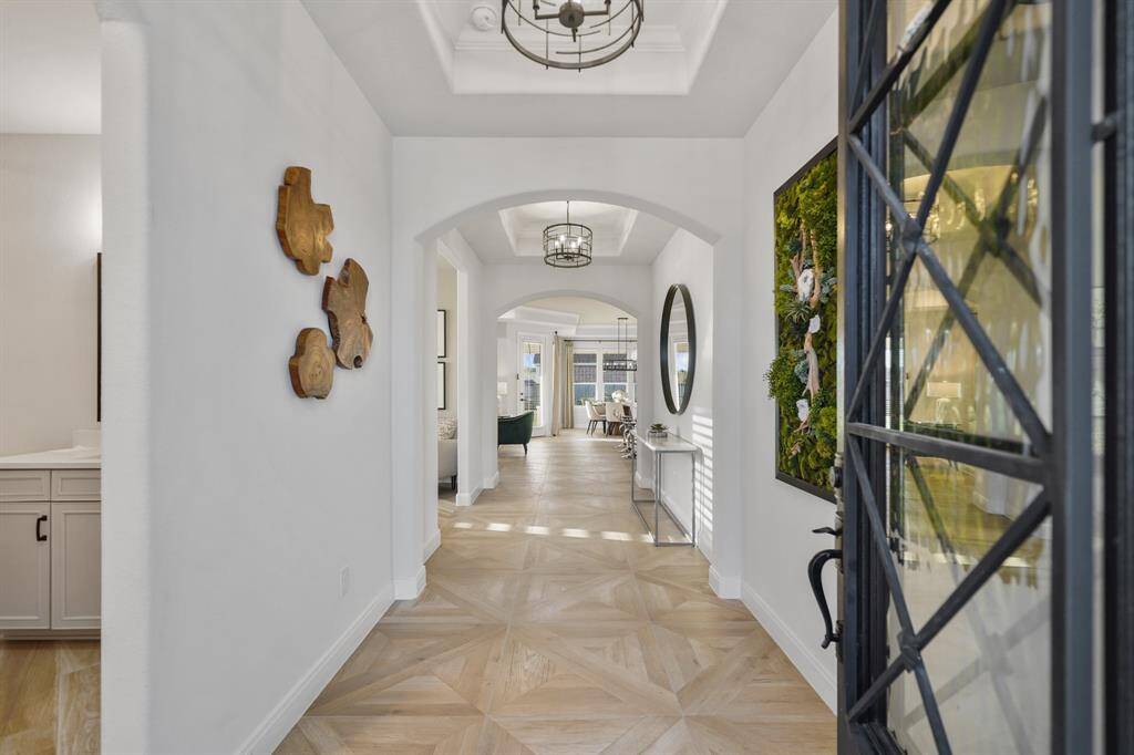 A grand entrance welcomes you with soaring ceilings in the foyer, setting the tone for this elegant home.