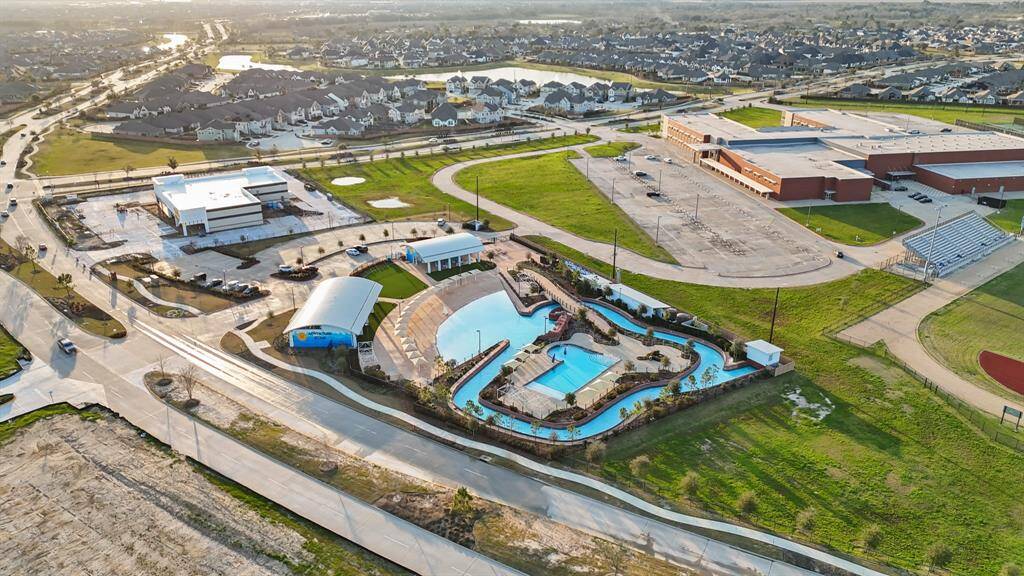 Aerial view of Adventure Cove. Huge pool with lazy river, Cabanas and hammock swings. Luxury resort living right in your backyard.