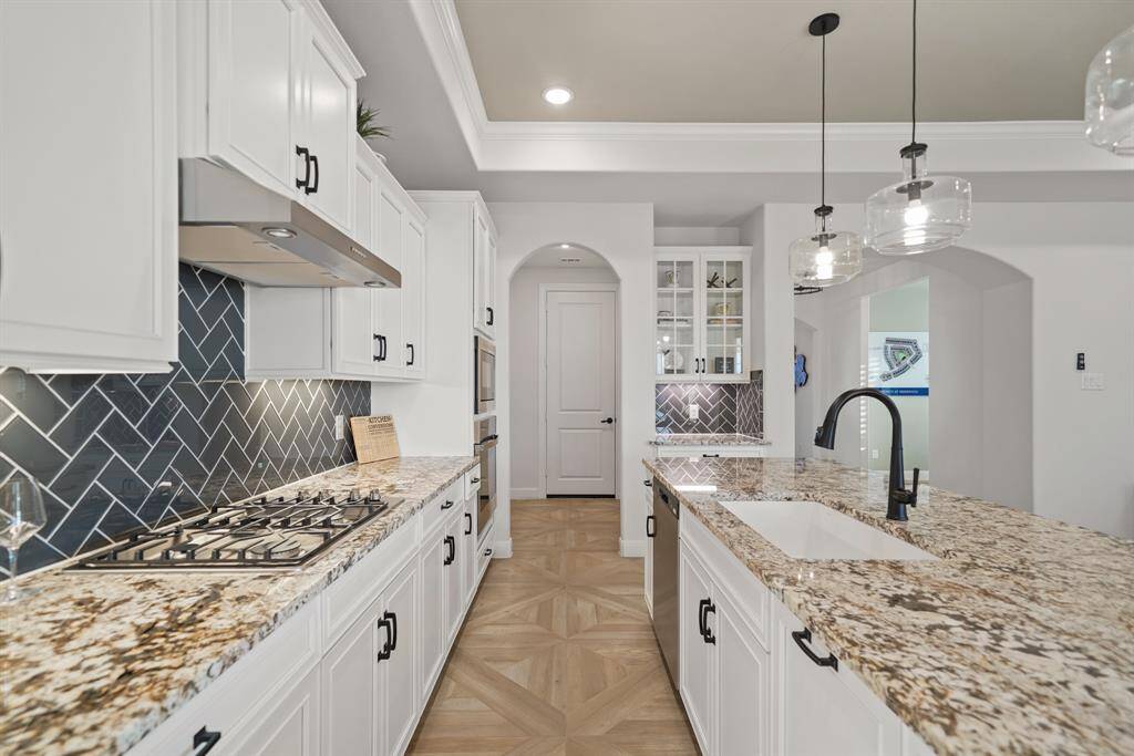 This gourmet kitchen is equipped with high-end appliances, combining style and performance for effortless cooking and entertaining.