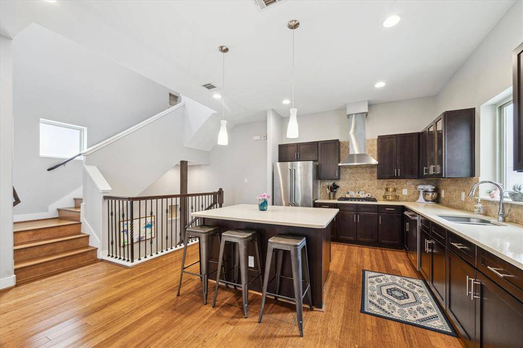 Beautiful,open kitchen featuring island and granite countertops.