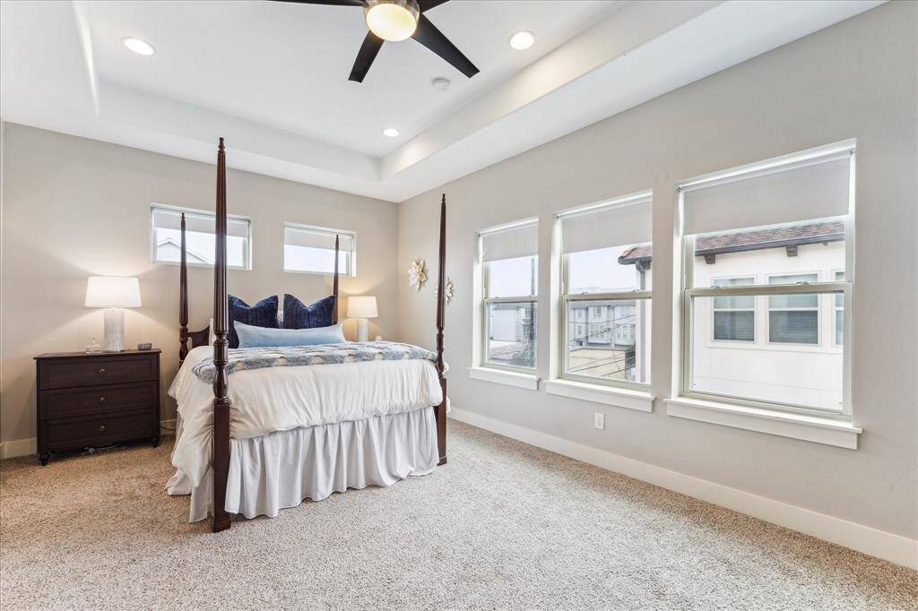Spacious principal bedroom with dual walk-in closets.