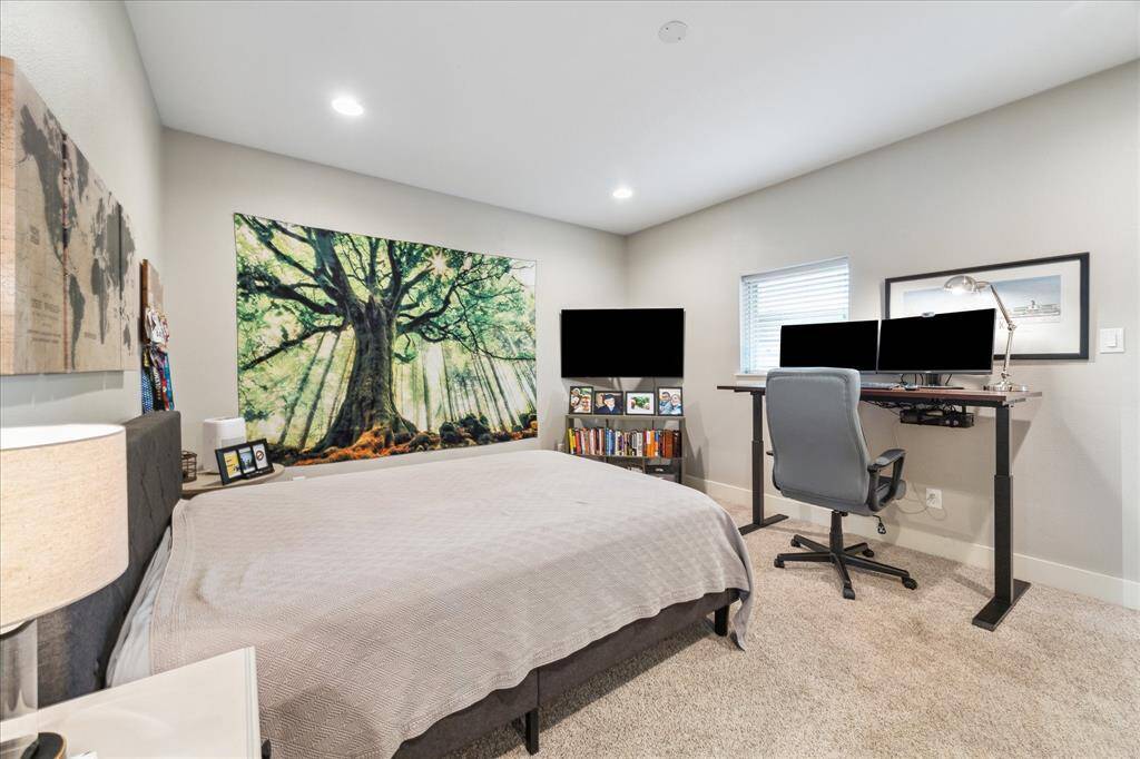 Spacious secondary bedroom featuring an en-suite bathroom and walk-in closet.