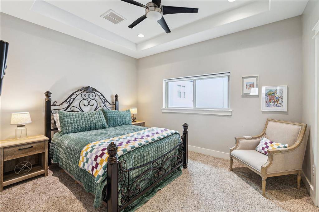 Third bedroom featuring a private en-suite and walk-in closet.