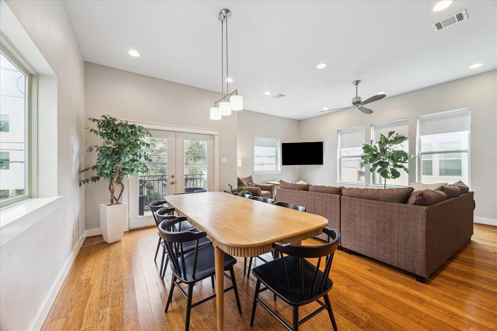 Elegant dining room with a balcony and a stylish wine bar.