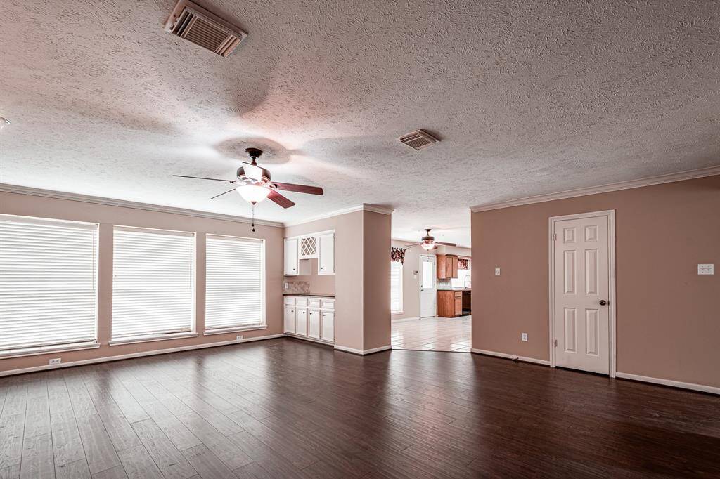 Half bath off of living room that is open to the kitchen.