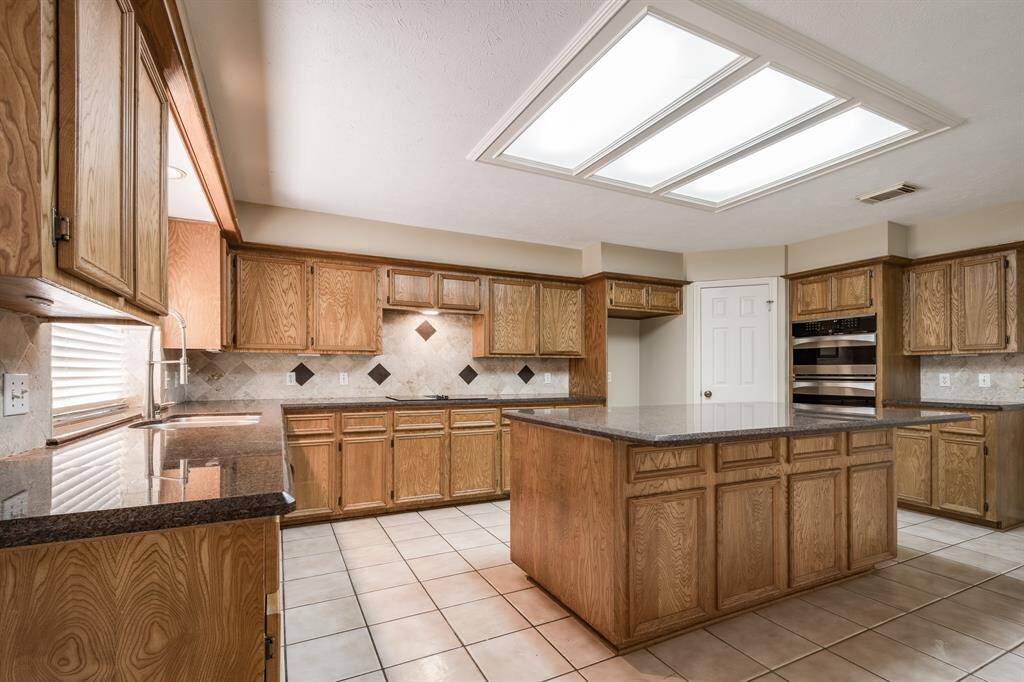 Granite counters and real wood cabinets.