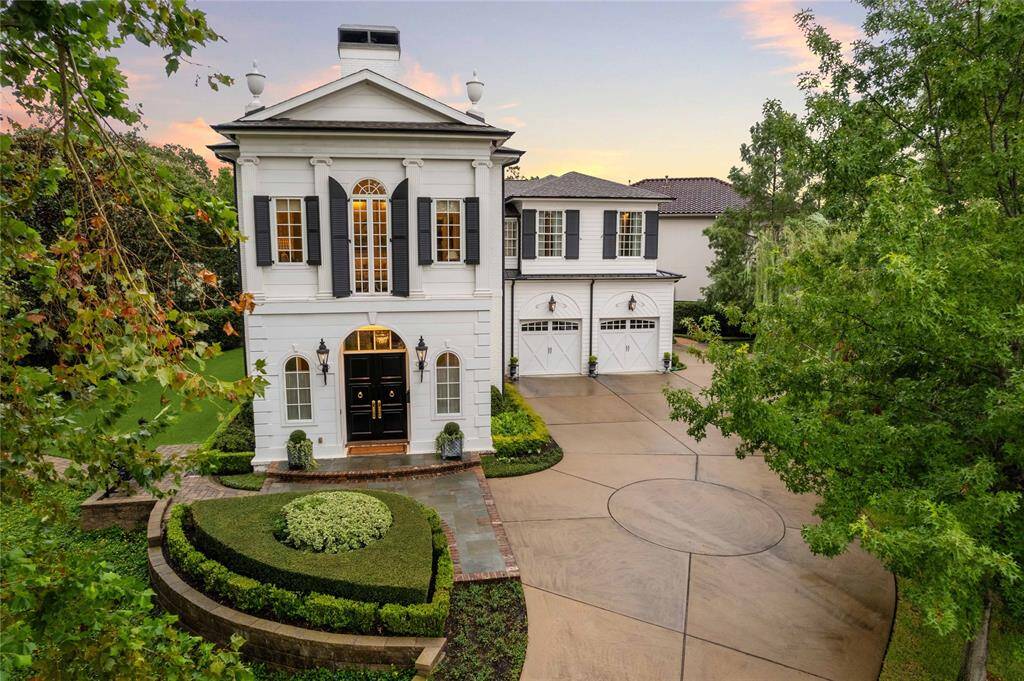 Stunning American Federal facade with lovely details and windows framed with carefully designed shutters.