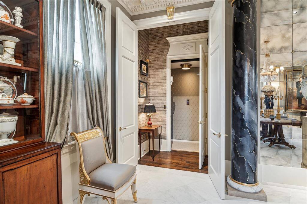 Elevator to the second floor connects the dining room and living room.