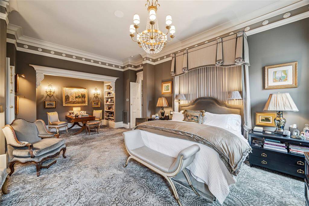 The primary suite is filled with light from the large windows and is a quiet retreat.