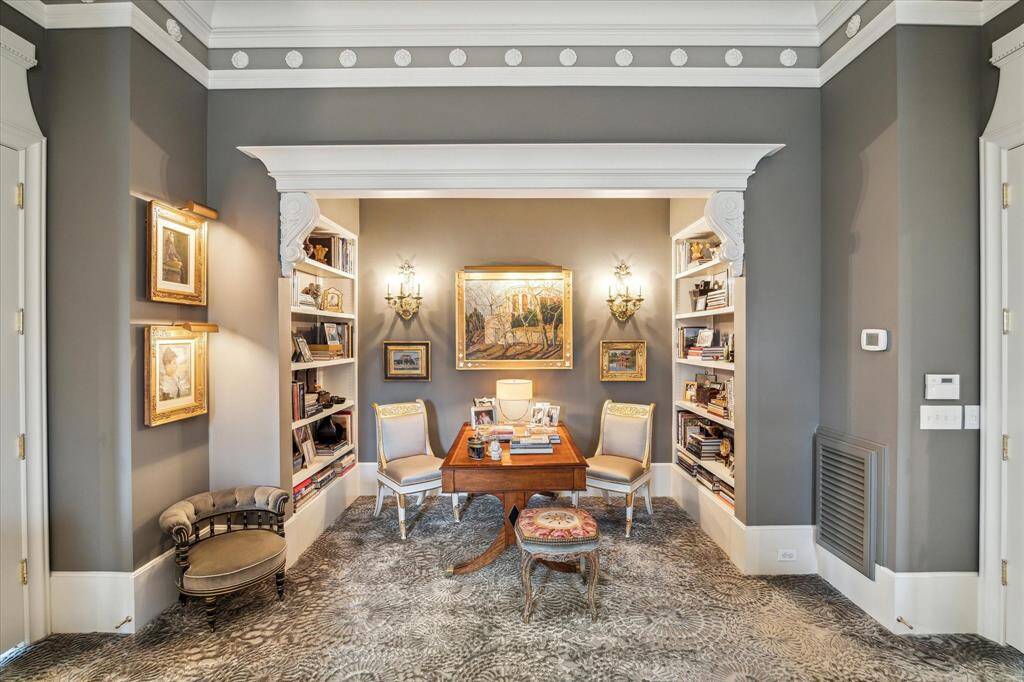 Sitting room or a quite place to work located in the primary suite.
