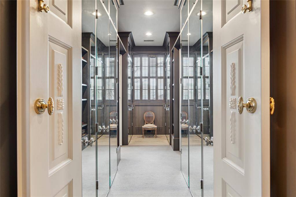 Mirrored dressing room in the primary bath.