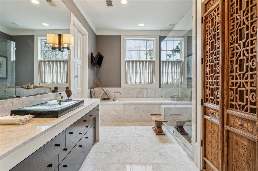 Primary bath with separate soaking tub and shower.