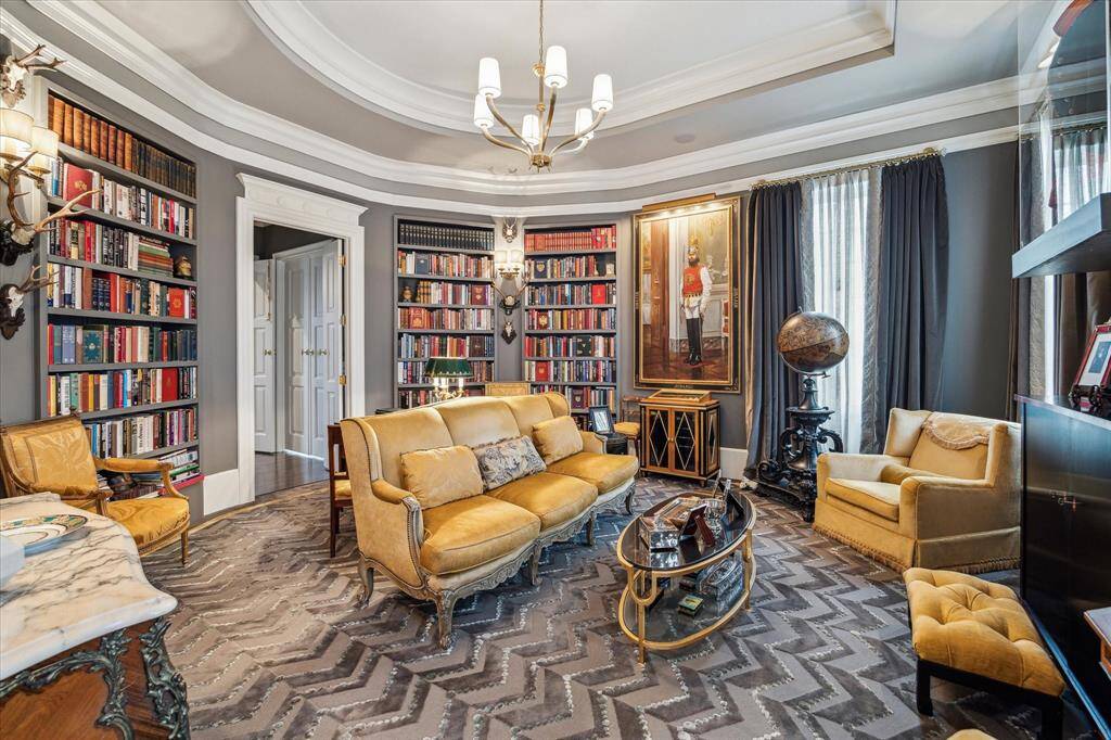 The library leads to a hallway connecting to the study/tv room.