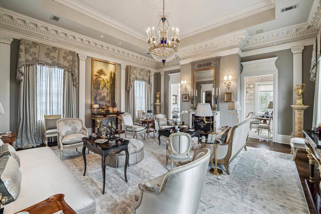 The living room also includes a marble fireplace and carefully chosen lighting.