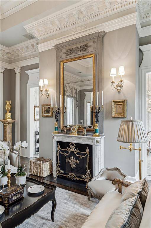 The marble fireplace is the centerpiece of the room and blends perfectly with the architecture.