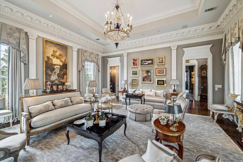 The elevator is nicely tucked in the corner of the living room framed by a lovely door frame.