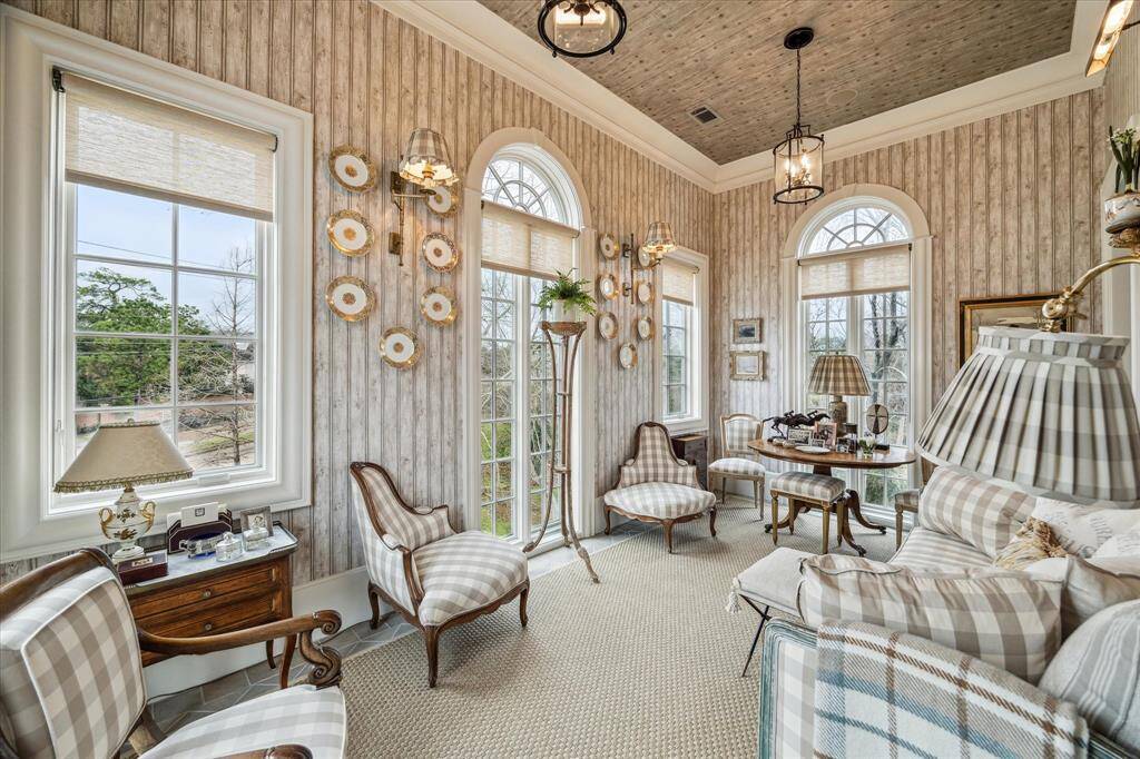 The sun room with abundant natural light is a wonderful room to rest in on a quiet afternoon.