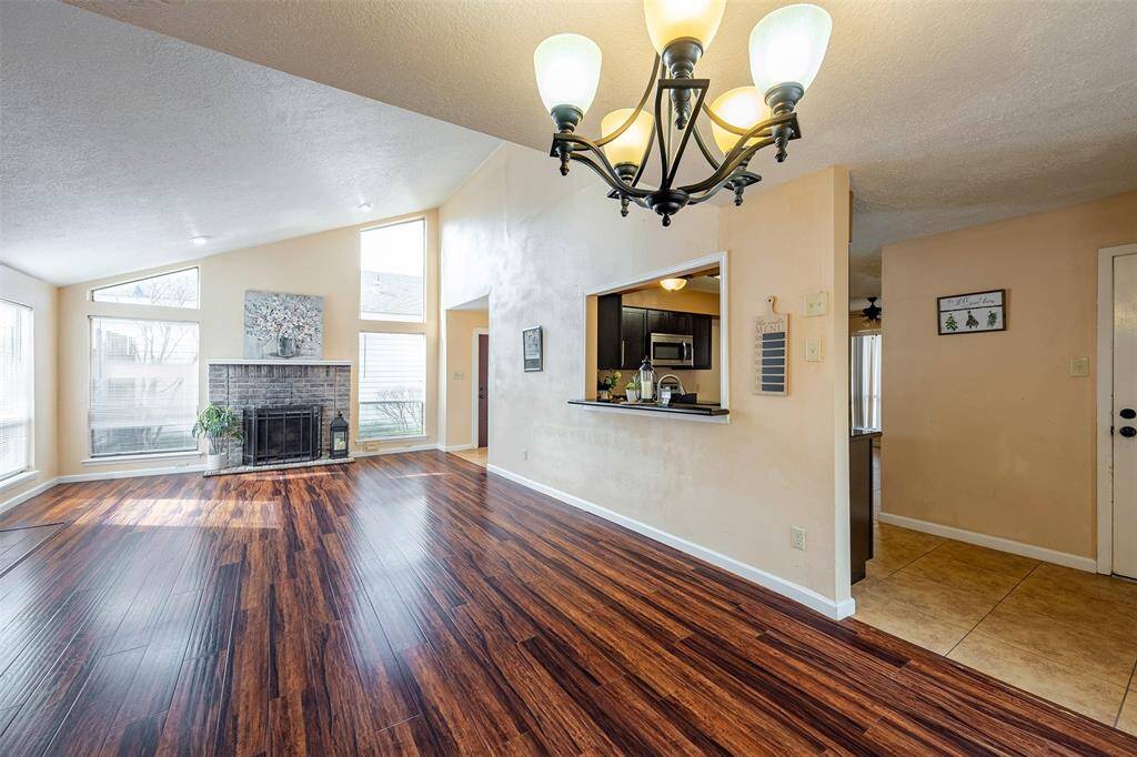 Another view of living room and the kitchen space.